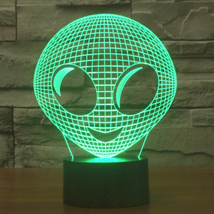 Alien-style desk lamp with glowing green wireframe alien head and dark base