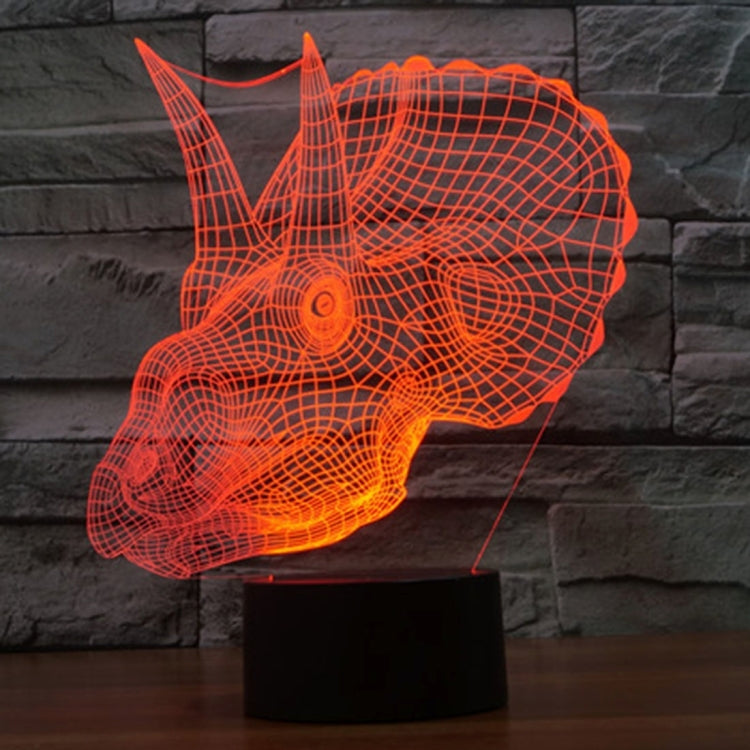 Orange dinosaur-shaped LED desk lamp with wireframe glow on stand
