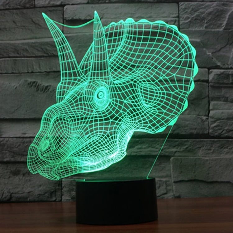 Green dinosaur-shaped LED desk lamp with wireframe glow on stand