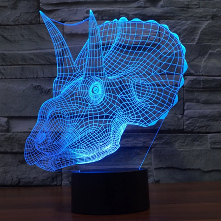 Blue dinosaur-shaped LED desk lamp with wireframe glow on stand