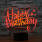 Happy Birthday 3D LED desk lamp glowing red on black base
