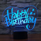 Happy Birthday 3D LED desk lamp glowing blue on black base