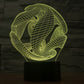 Abstract 3D wire desk lamp with yellow-green glow on black base