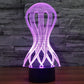 LED desk lamp with glowing purple wireframe jellyfish style shade and black base
