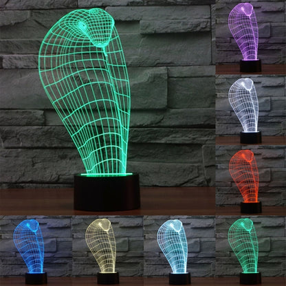 Cobra-style 3D wire grid desk lamp, glowing in multiple colors on a black base
