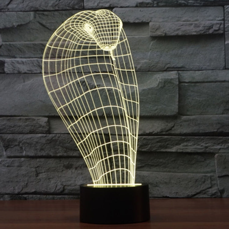 Cobra style wireframe desk lamp with warm yellow LED glow and black base