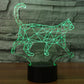 Walking cat shape LED desk night light with green geometric glow, black base