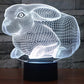 Rabbit-shaped desktop night lamp with white glow and black round base