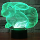 Green glowing rabbit-shaped night light desk lamp on a black base