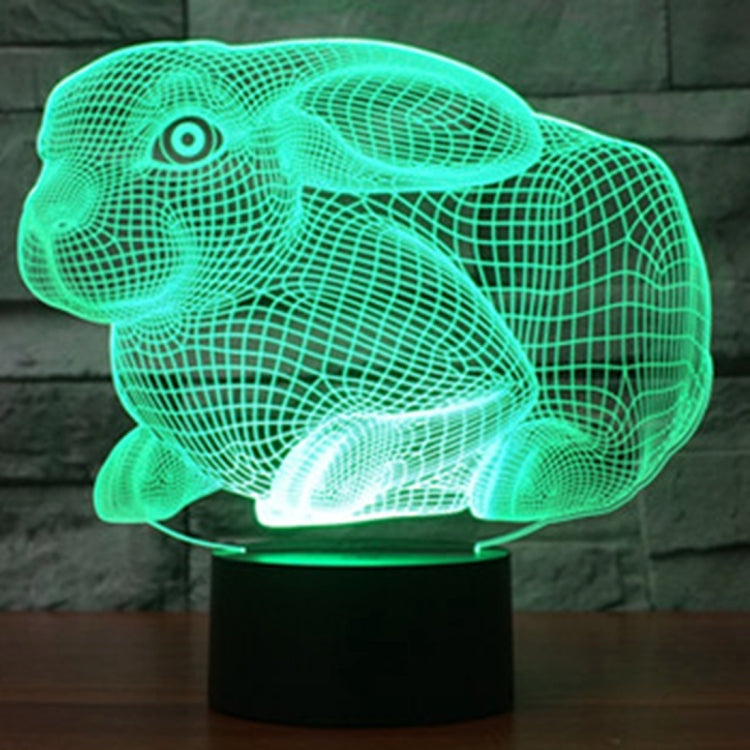 Green glowing rabbit-shaped night light desk lamp on a black base