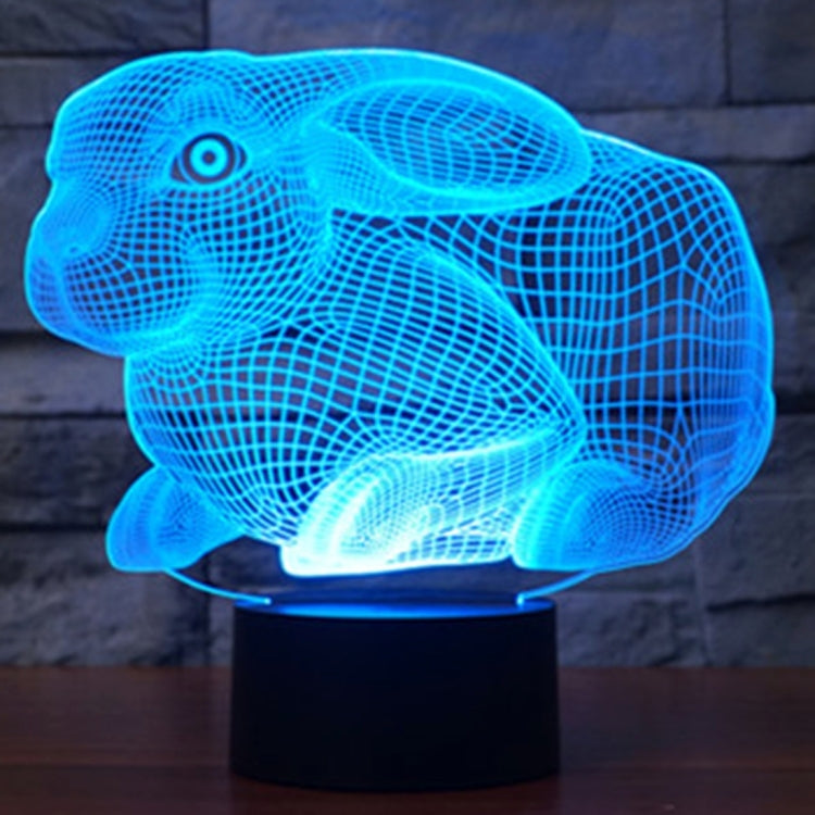 Blue glowing rabbit-shaped night light desk lamp on a black base