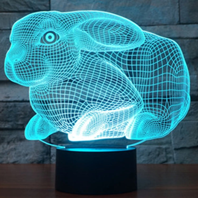 Cyan blue glowing rabbit-shaped night light desk lamp on a black base