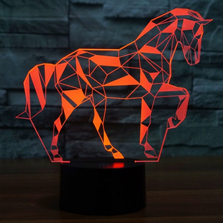 Geometric horse-shaped LED desk lamp with bright orange glow on a black base.
