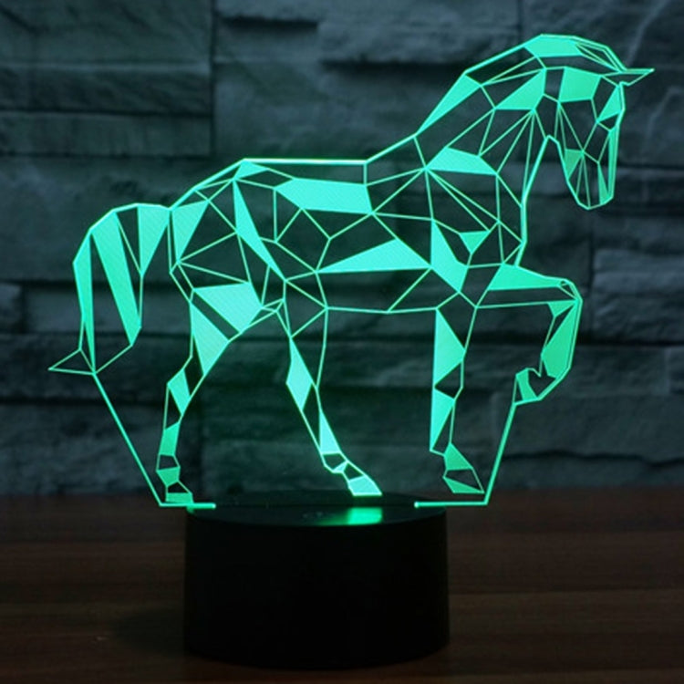 Geometric horse-shaped LED desk lamp with vivid green glow on a black base.