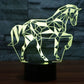 Geometric horse-shaped LED desk lamp with pale yellow-green glow on a black base.