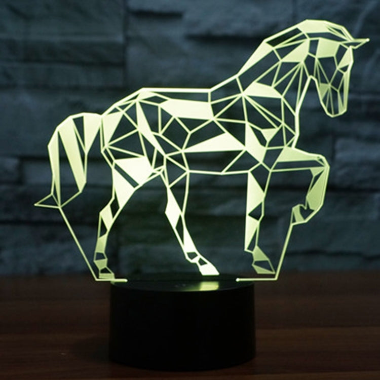 Geometric horse-shaped LED desk lamp with pale yellow-green glow on a black base.