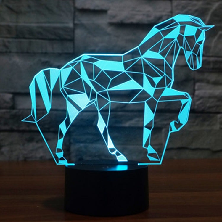 Geometric horse-shaped LED desk lamp with cyan blue glow on a black base.