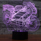 Motorcycle-shaped LED night light with purple wireframe glow on black base