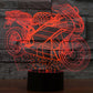 Motorcycle-shaped LED desk lamp, orange-red glowing outline on black base
