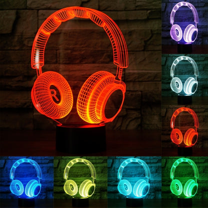 Headset-shaped desk lamp with orange LED glow on round black base