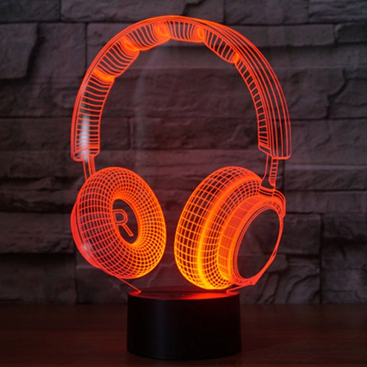 Headset-shaped desk night light with orange LED glow on round base