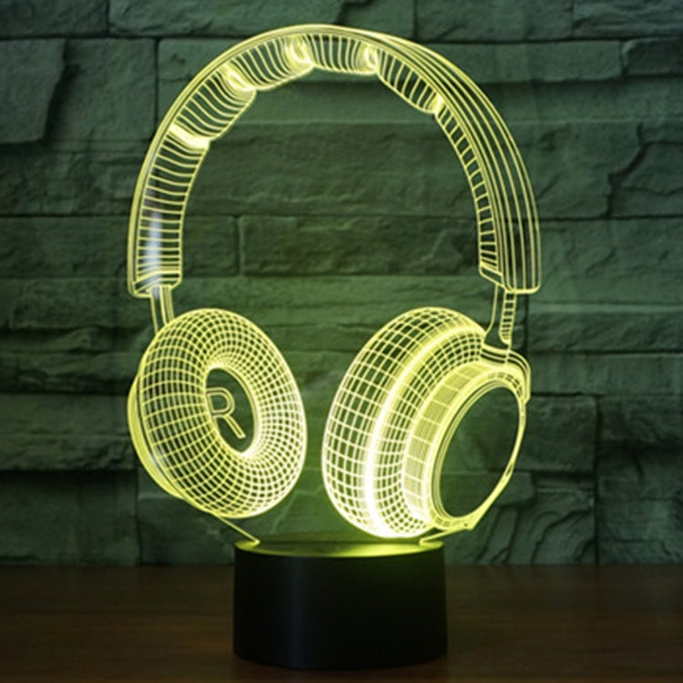 Headset-shaped desk lamp with yellow-green LED glow on round black base