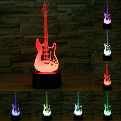 Guitar-shaped 7-color LED night light with black base, red and multicolor glow