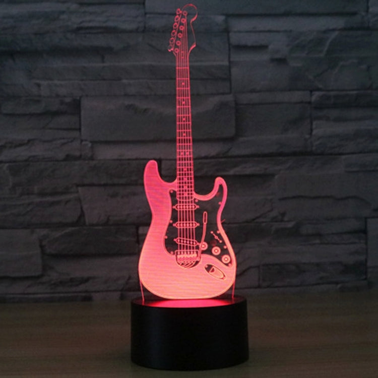 Guitar-shaped LED night light with black base, red/pink glowing guitar