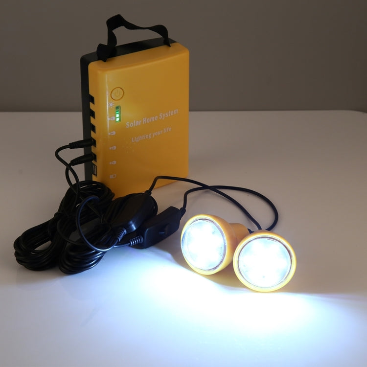 Portable solar power light system with yellow control box and two glowing round bulbs
