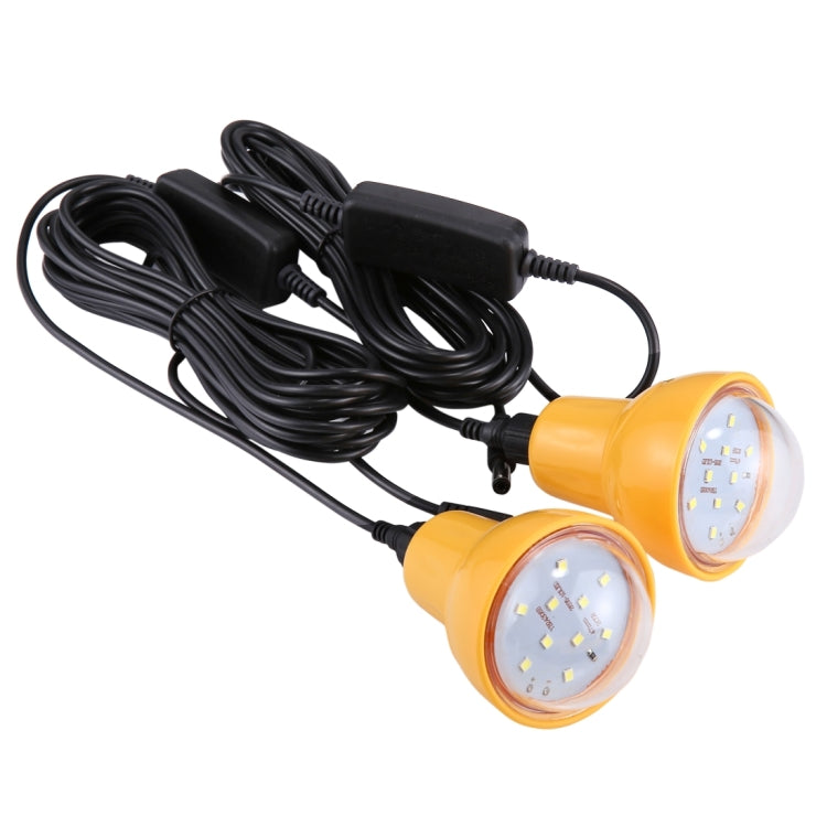 Two round LED bulbs on a cable harness with yellow bulb housings