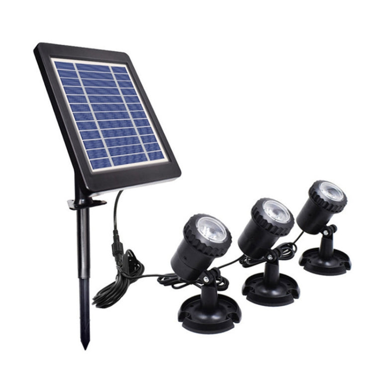Solar panel stake with three black LED spotlights and cables for outdoor warm lighting
