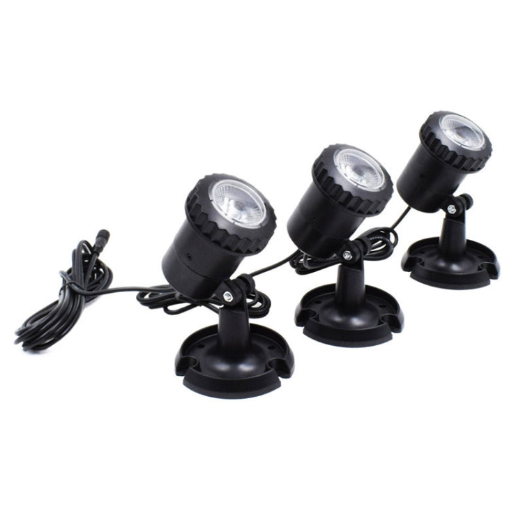 Three-head black solar LED spotlights with round bases and connected cables