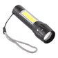 Black zoomable COB flashlight with lanyard and control buttons on the handle