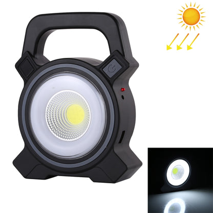 Black handheld camping lamp with circular COB LED panel and carry handle