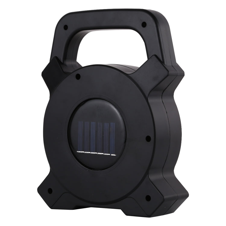 Black handheld camping lamp back with built-in solar panel grille