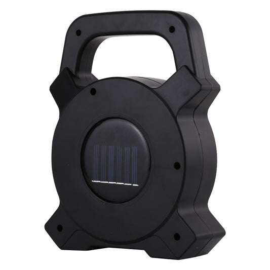 Black handheld camping lamp back with built-in solar panel grille