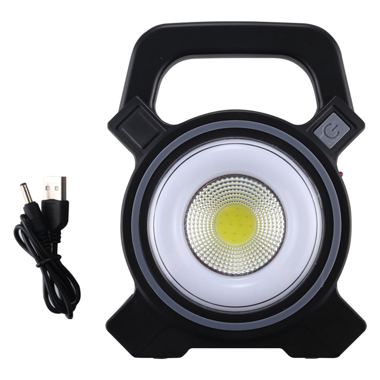 Black handheld camping lamp with circular COB LED and included charging cable