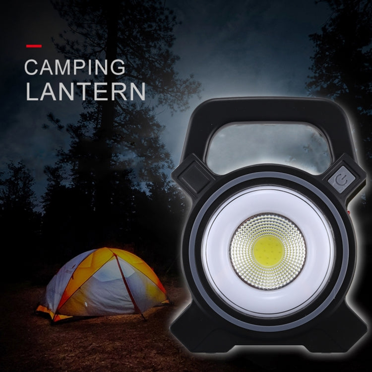 Black handheld camping lantern with circular COB LED glow