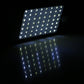 Solar wall light LED panel glowing bright white, black motion-sensor housing