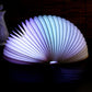 Cool white and lavender folding semicircle night light glow