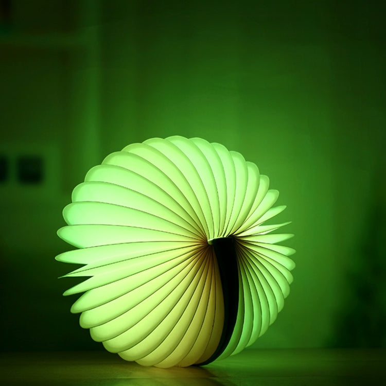 Green glowing folding semicircle night light with ribbed light