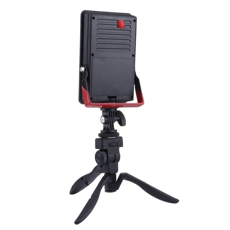 Back view of black LED emergency light with red button and vented panel
