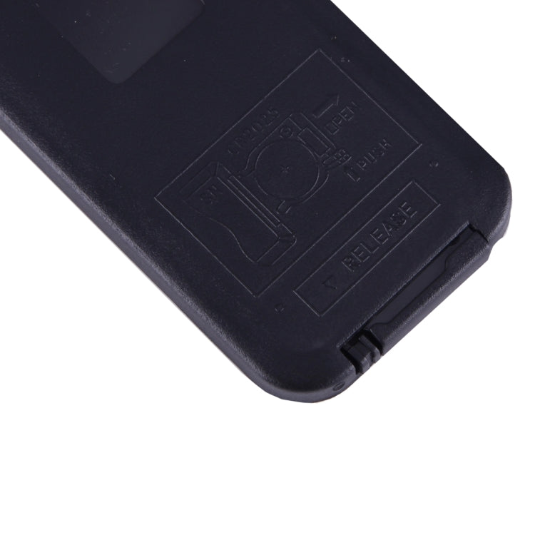 Black controller housing with embossed markings on the back corner