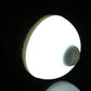 E27 infrared motion sensor LED bulb glowing white with visible front sensor lens