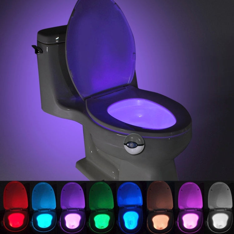 Grey toilet seat night light with purple LED glow on the lid