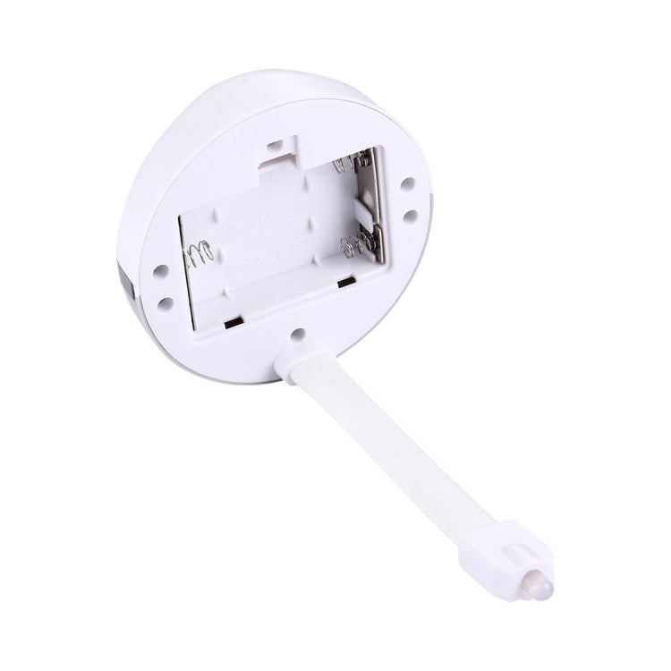Toilet seat night light base showing open battery compartment and contacts