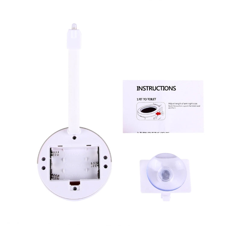 Toilet seat night light with wall plug, open base, and instruction packet