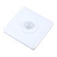 White motion sensor switch panel with circular detection lens, tilted view