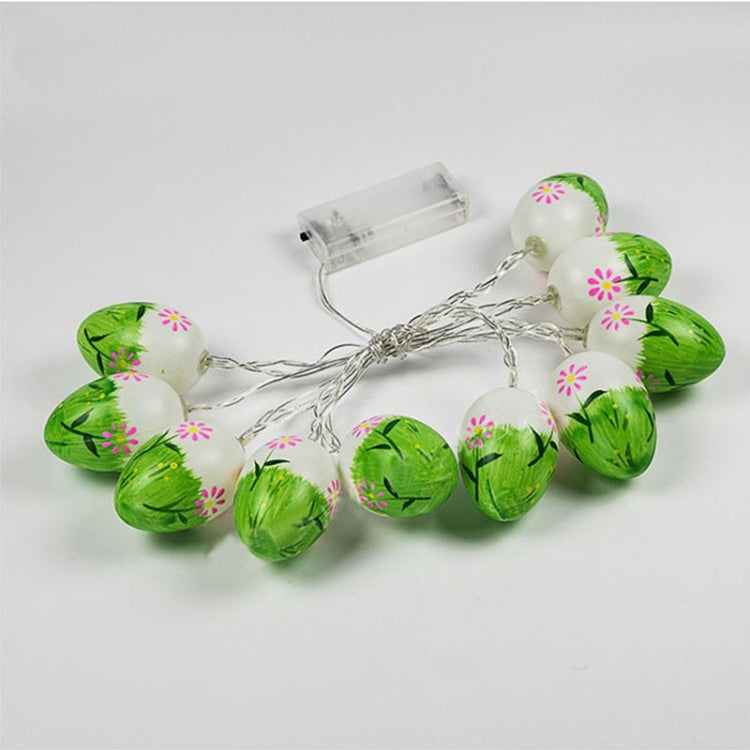 Easter egg LED string lights with green and pink painted bulbs on silver wire