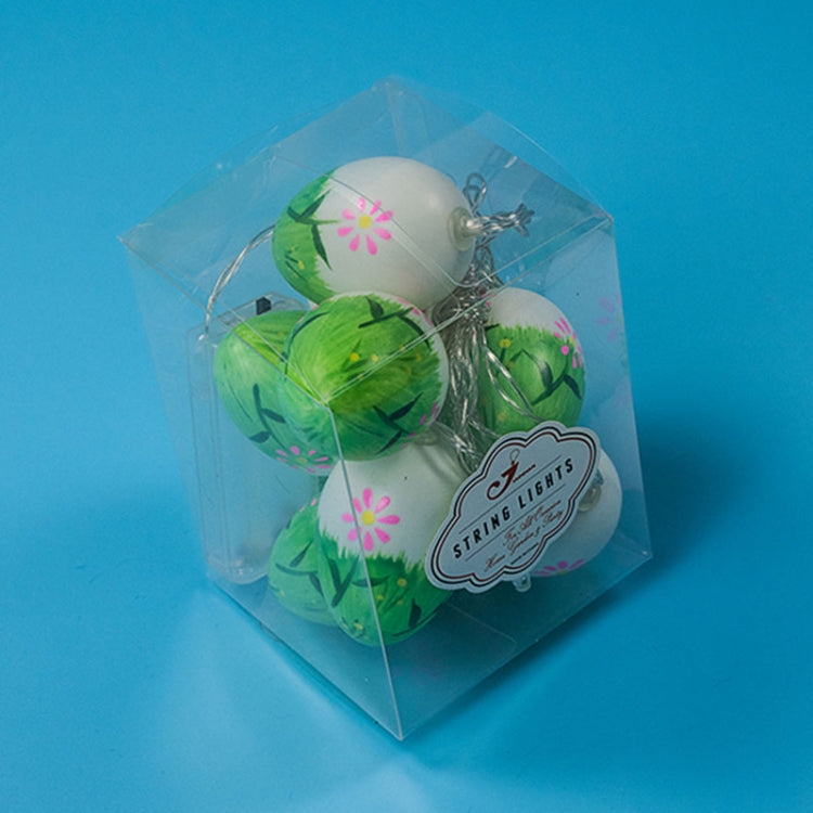 LED Easter egg string lights in clear gift box with green eggs and label